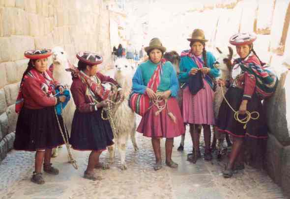 Peru Llama girls and Inca stonework
